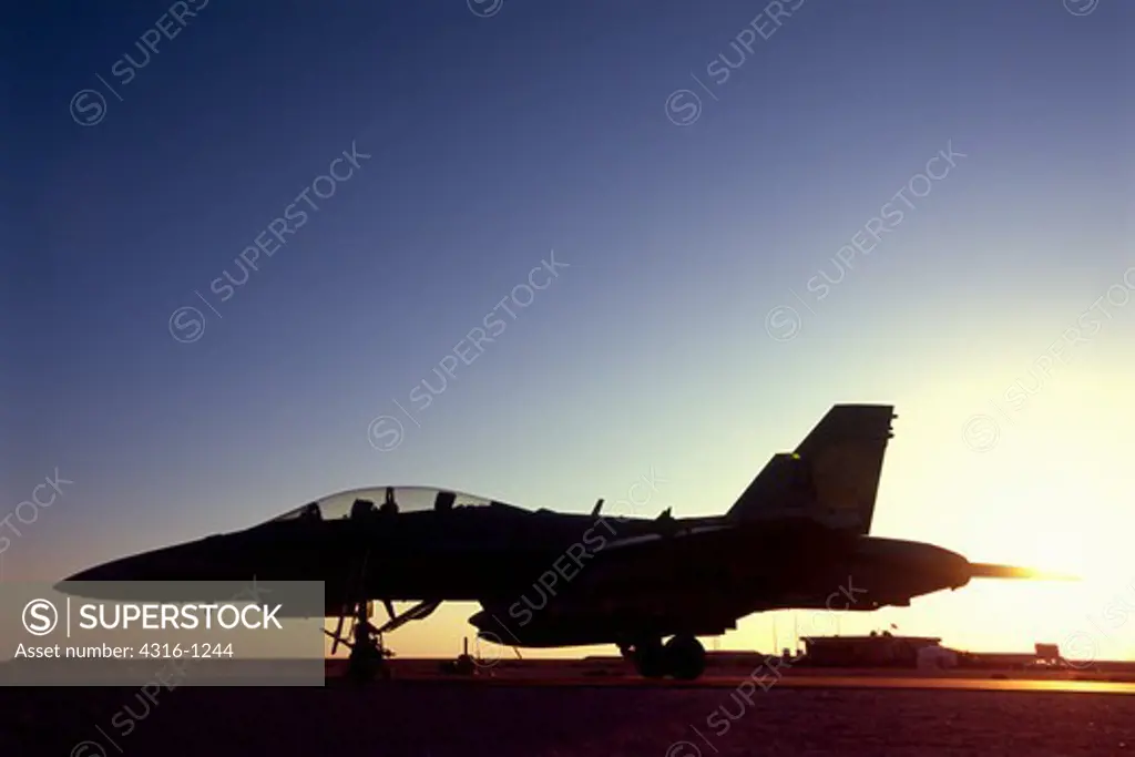 Silhouette of a US Marine F/A - 18D Hornet at Al Asad Air Base in the Anbar Province of Iraq