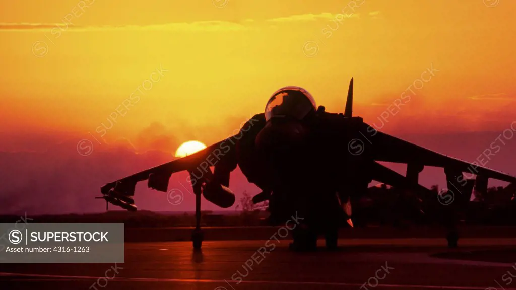 The Setting Sun Silhouettes a US Marine AV-8B Harrier at Al Asad Air Base in the Anbar Province of Iraq