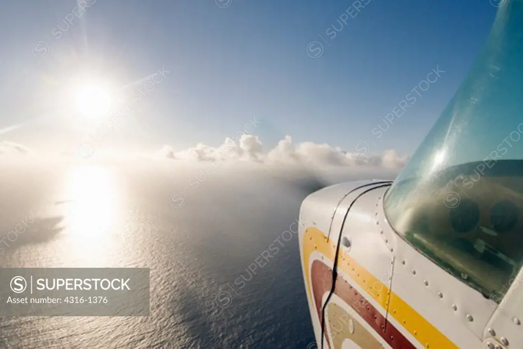 View of the Nose Section of an in-Flight Cessna 172 Speeding Above the Kaiwi Channel