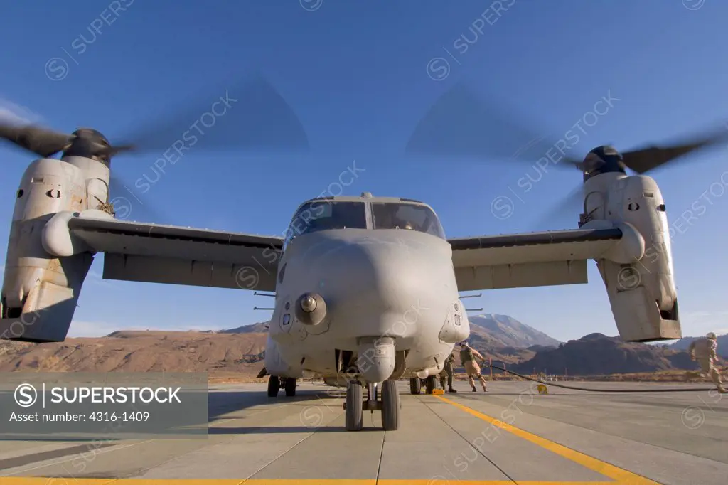 Air Crew Refuel an Idling V-22 Osprey