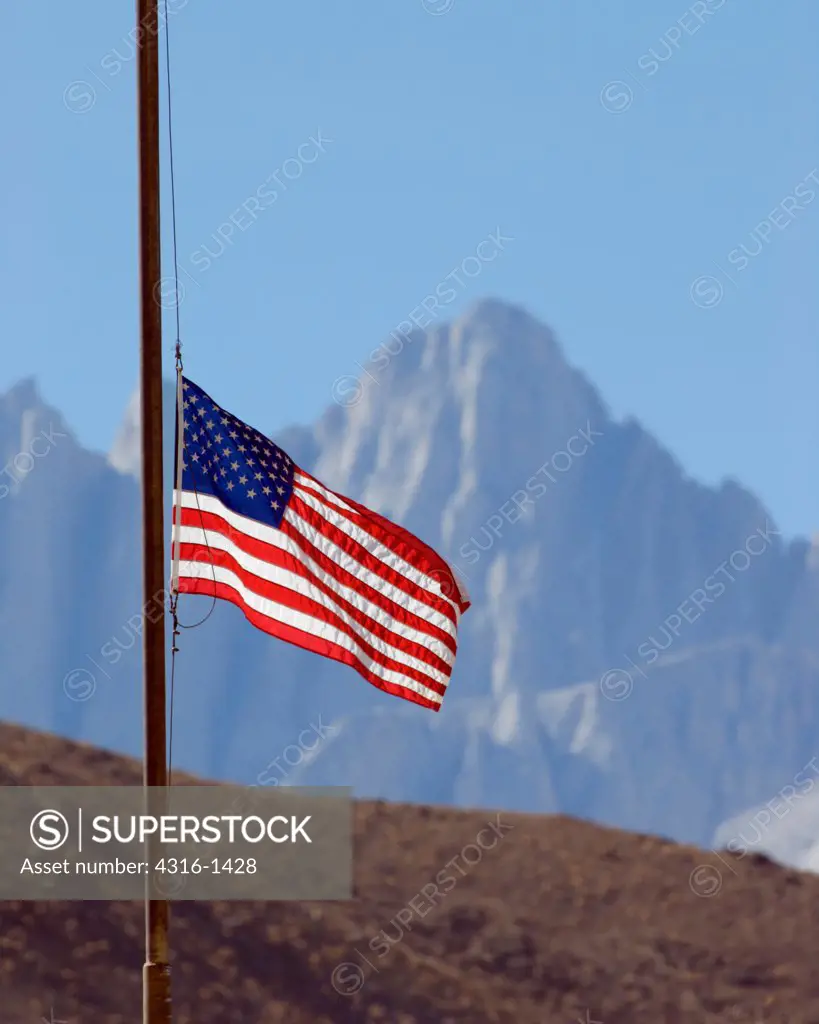 Mount Whitney, The Highest Mountain in California, Stands as a Backdrop to a United States Flag Being Flown at Half Staff