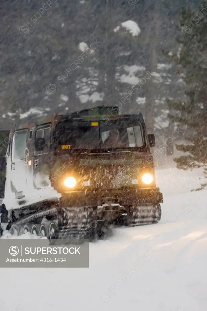 BV' Snow Vehicle,Maneuvers Through California's Sierra Nevada During A Blizzard