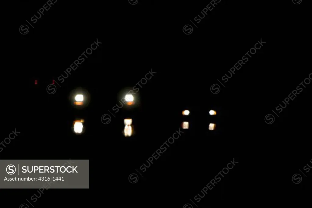 Car Headlights at Night Distorted by Inferior Mirage Near Marfa, Texas, Creating the Marfa Mystery Lights