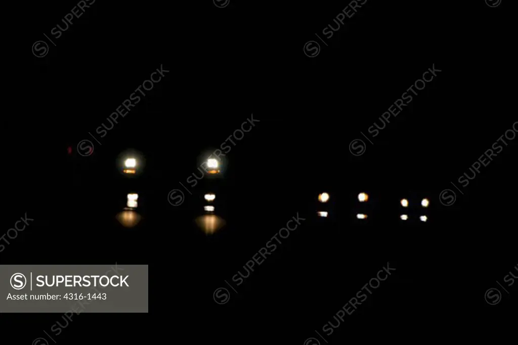 Car Headlights at Night Distorted by Inferior Mirage Near Marfa, Texas, Creating the Marfa Mystery Lights