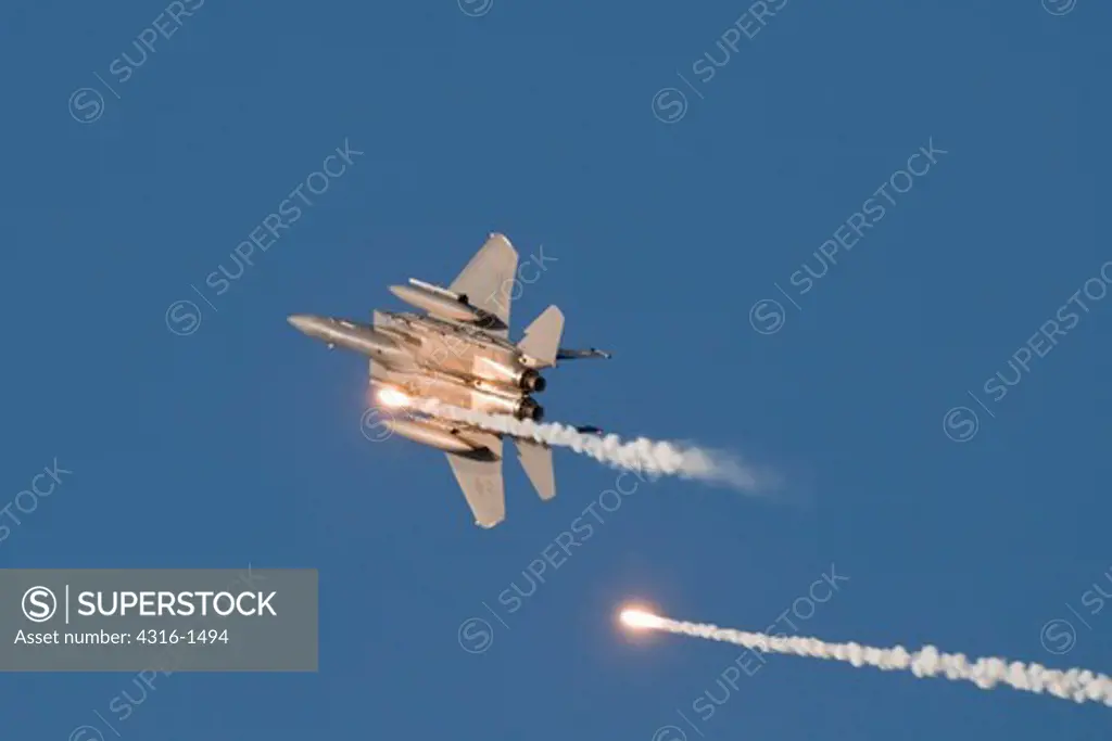 An F-15 Eagle Expends Flares After Strafing a Target