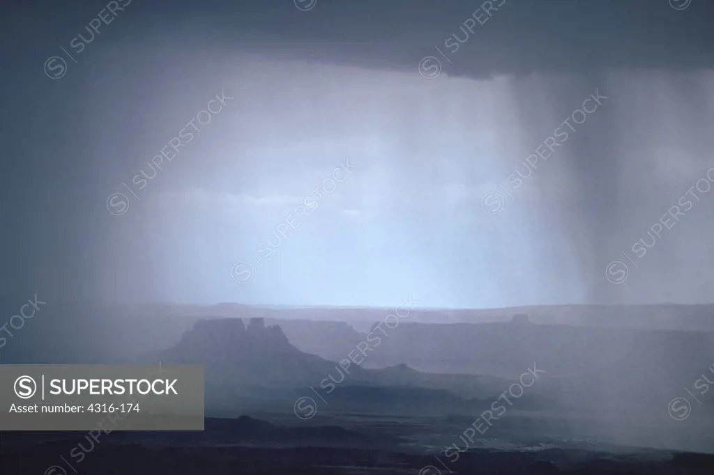 Curtains of Desert Rain Envelop a Lonely Butte