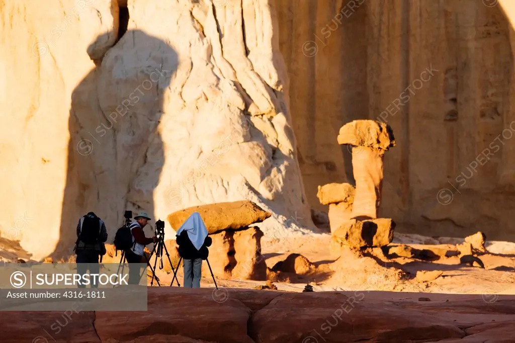 Photographers Amid 'Toadstool' Rock Formations