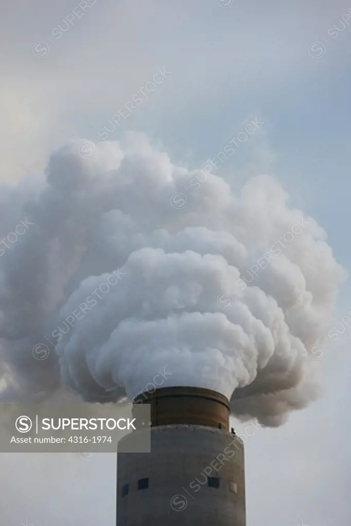 Smokestack Dumping Steam and Exhaust into the Sky