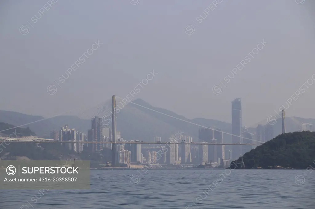 View of the Ting Kau Bridge and buildings of Hong Kong from the Rambler Channel, China