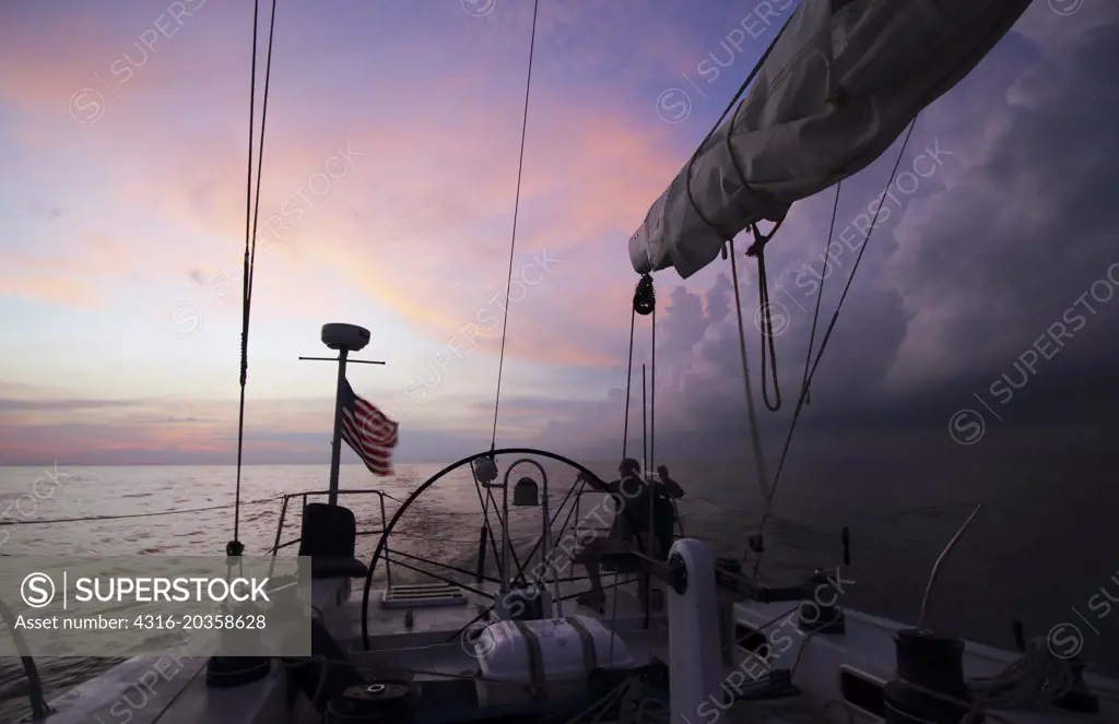 Dawn light, storm, in Strait of Malacca as seen from a racing yacht