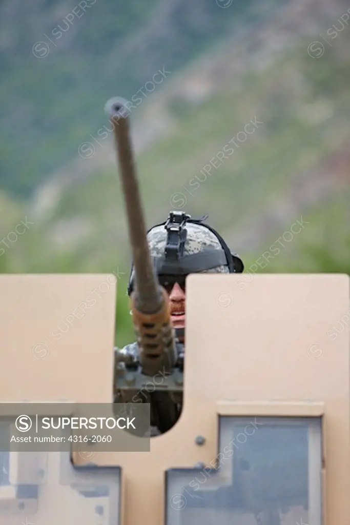 United States Army Soldier Behind a Vehicle Mounted M2 .50 Caliber Machine Gun