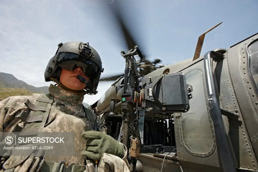 U.S. Army Air Crewman And Blackhawk Helicopter at a Base in Afghanistan's Eastern Kunar Province