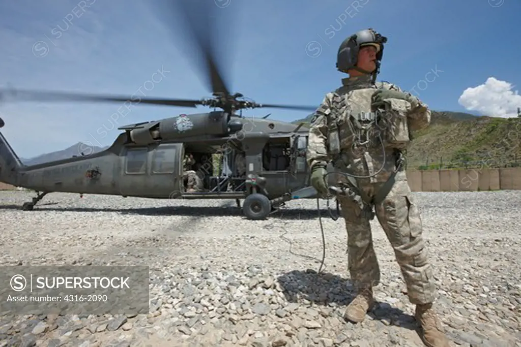 U.S. Army Air Crewman and Blackhawk Helicopter at a Base in Afghanistan's Eastern Kunar Province