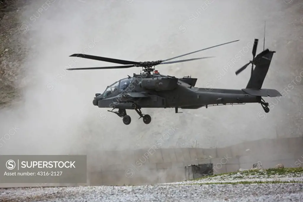 A United States Army AH-64 Apache Helicopter Gunship Launches From a Forward Operating Base Near The City of Asadabad, in Afghanistan's Eastern Kunar Province