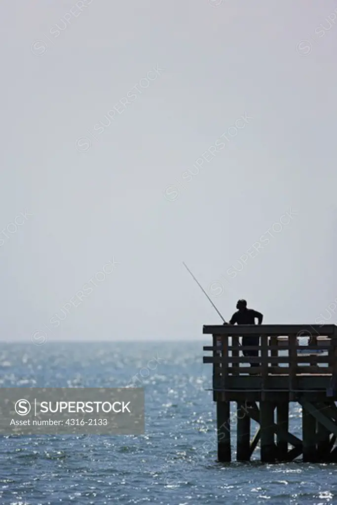 Man Fishing at End of Pier at Cape Charles, Virginia