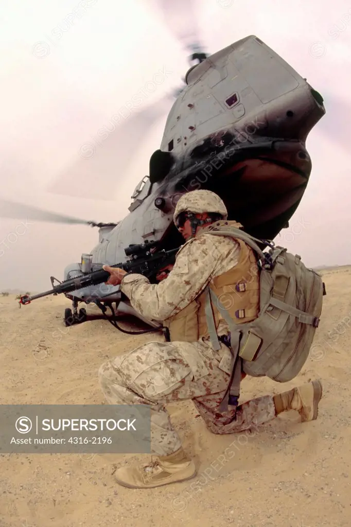 A US Marine Scans the Perimeter of a Helicopter Landing Zone During Medevac Training