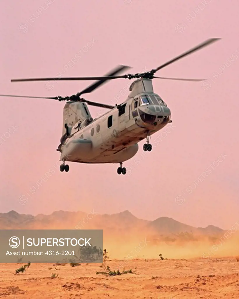 A US Marine Corps CH-46 Sea Knight Kicks Up Dust on its Approach to a Desert Helicopter Landing Zone