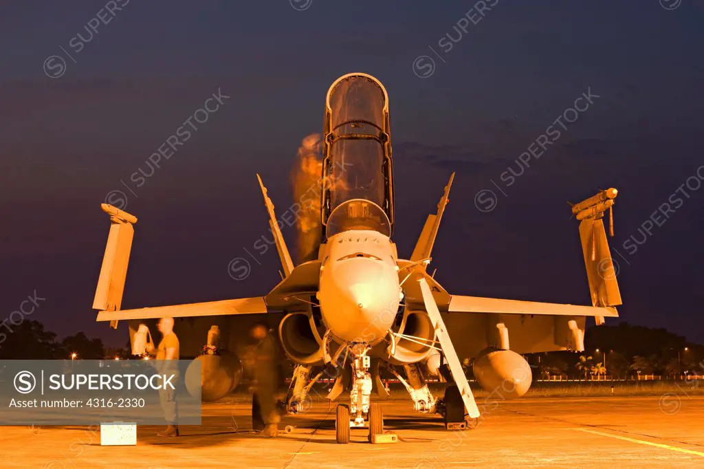United States Marine Corps Aircraft Maintainers Prepare an F/A-18D Hornet For a Flight Before Dawn at Kuantan Air Base, Malaysia