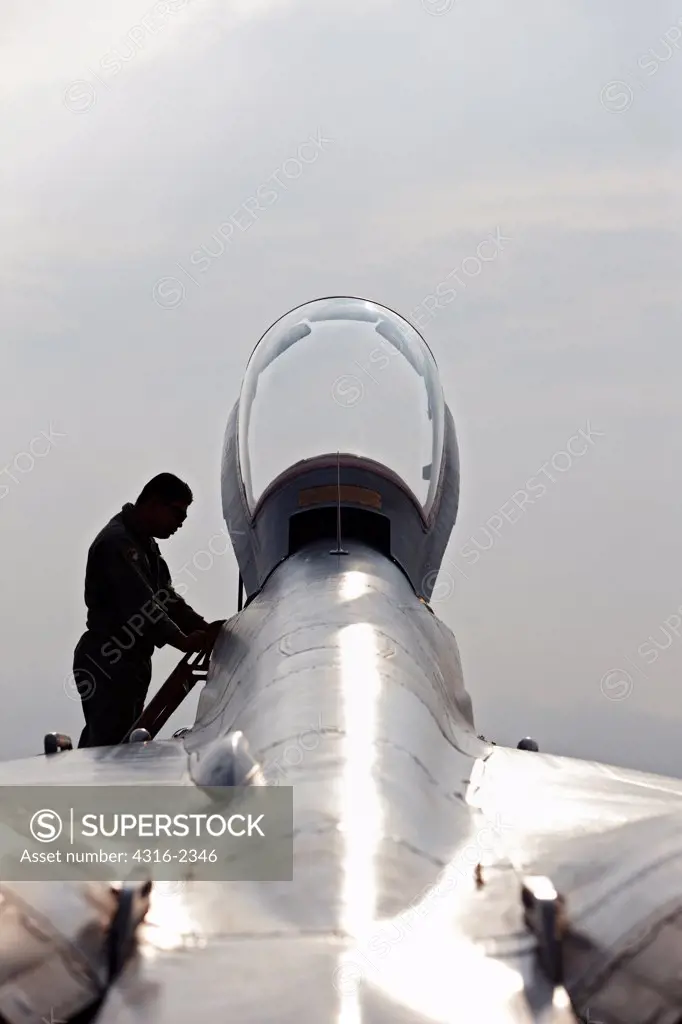 A Malaysian Air Force pilot steps into the cockpit of a Mig-29 Fulcrum at Kuantan Air Base, Malaysia.