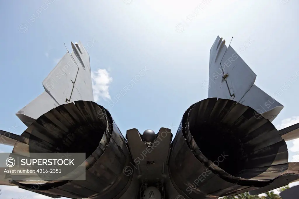 The exhaust nozzles and vertical stabilizers of a Malaysian Air Force Mig-29 Fulcrum at Kuantan Air Base, Malaysia.