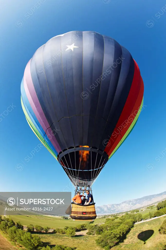 A hot air balloon flies above the Carson Valley near Gardnerville, Nevada.