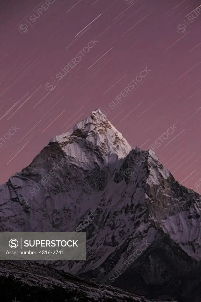Star trails and the last of the daylight over Ama Dablam, Everest region of Nepal.