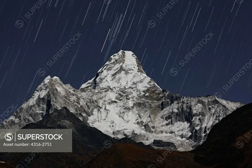 Star trails above Ama Dablam, Mount Everest region of Nepal.