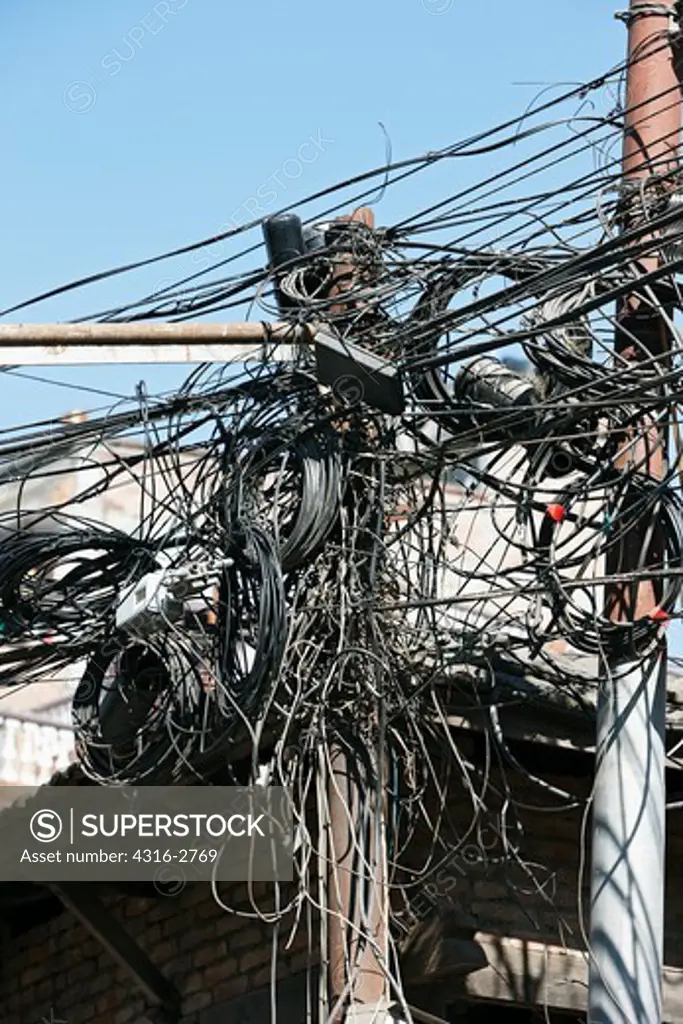 Tangled telephone and power lines, Kathmandu, Nepal.
