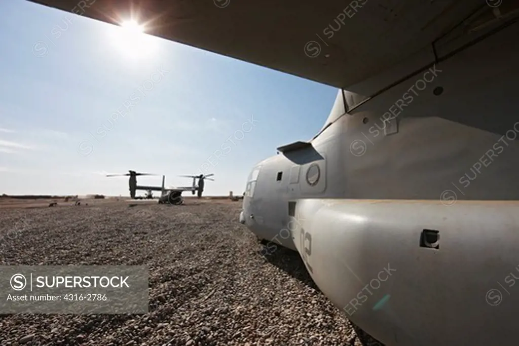 U.S. Marine Corps MV-22 Ospreys idle at a combat outpost in the Helmand Province of southern Afghanistan.