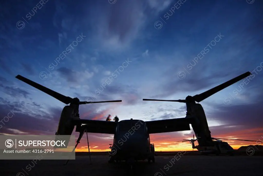 U.S. Marine Corps aircraft maintainers work on an MV-22 Osprey at dawn, Camp Bastion, Helmand Province of southern Afghanistan.