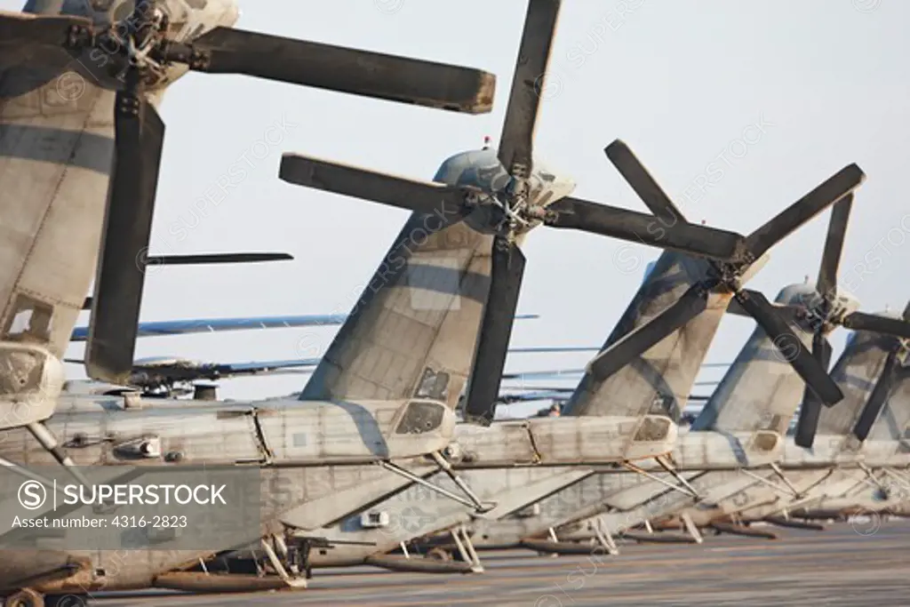 View of tail sections of CH-53E Super Stallion helicopters parked in a line at Camp Bastion, Helmand Province, Afghanistan.