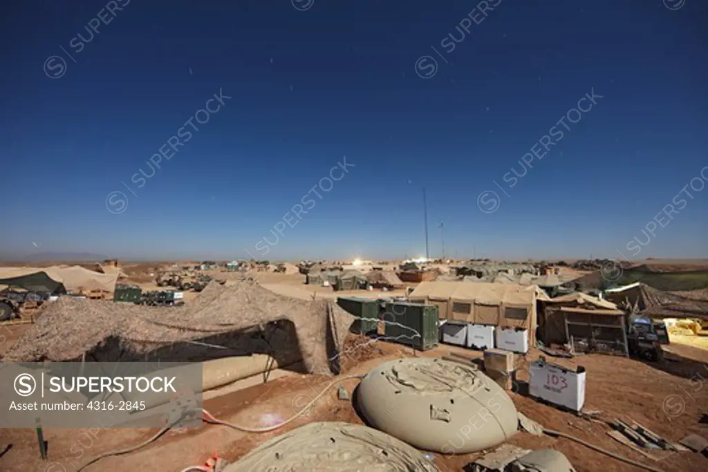 Nighttime view of a combat outpost, in southern Helmand Province, Afghanistan.