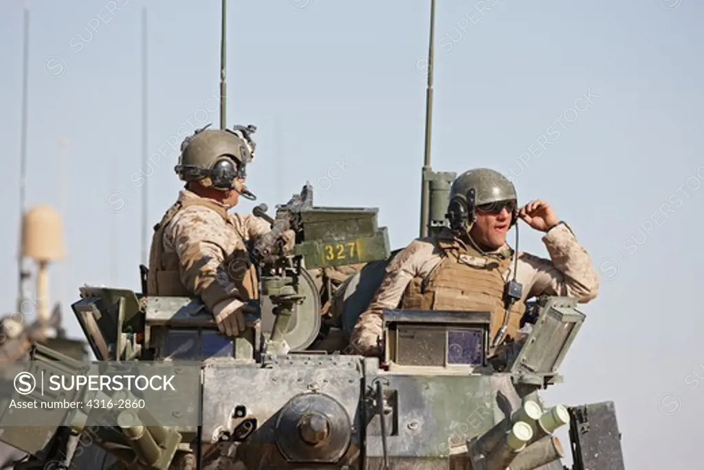 A U.S. Marines atop an LAV-25, in southern Helmand Province, Afghanistan.