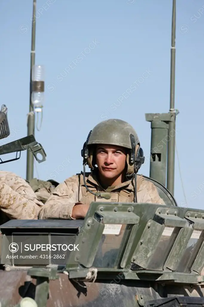 A U.S. Marine atop an LAV-25, southern Helmand Province, Afghanistan.