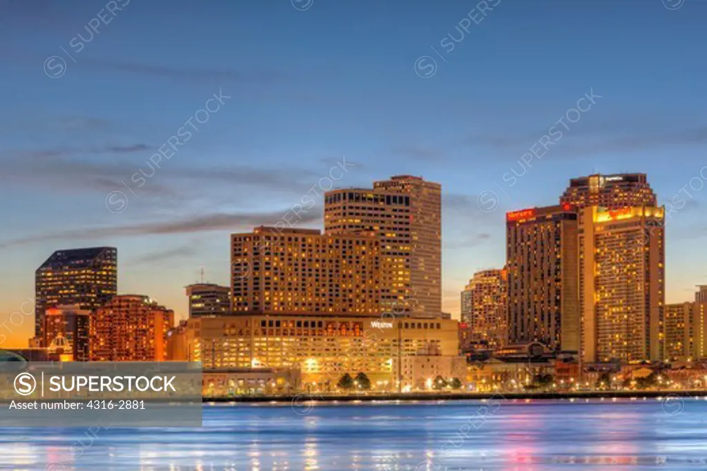 A high dynamic range, or HDR, image of high rise buildings of New Orleans, Louisiana and the Mississippi River, as seen from the Algiers Point Section of New Orleans, Louisiana.