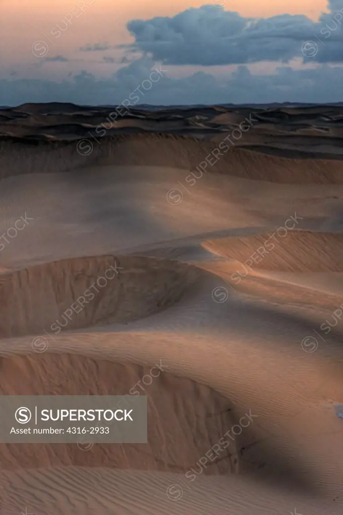 Sand dunes at dawn, near the town of El-Aaiun, Western Sahara.
