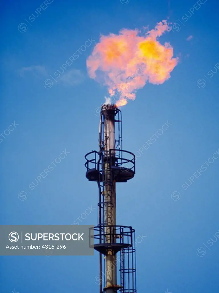 Flaring Tower of an Oil Refinery Reduces Unusable Hydrocarbons to Flame