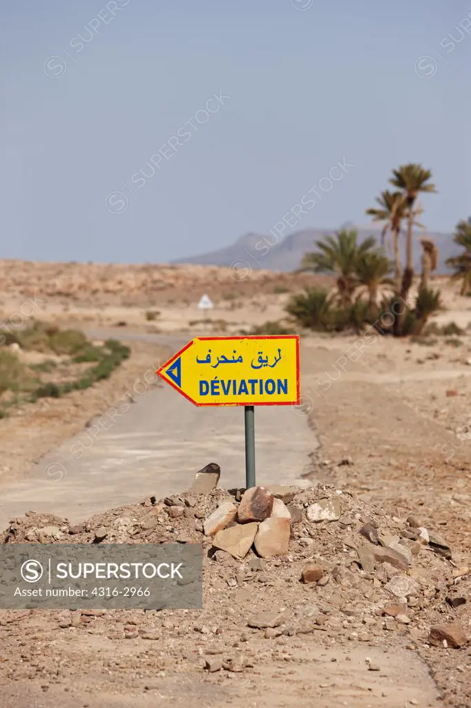 A sign marks a detour along a road in Morocco's interior Sahara Desert.