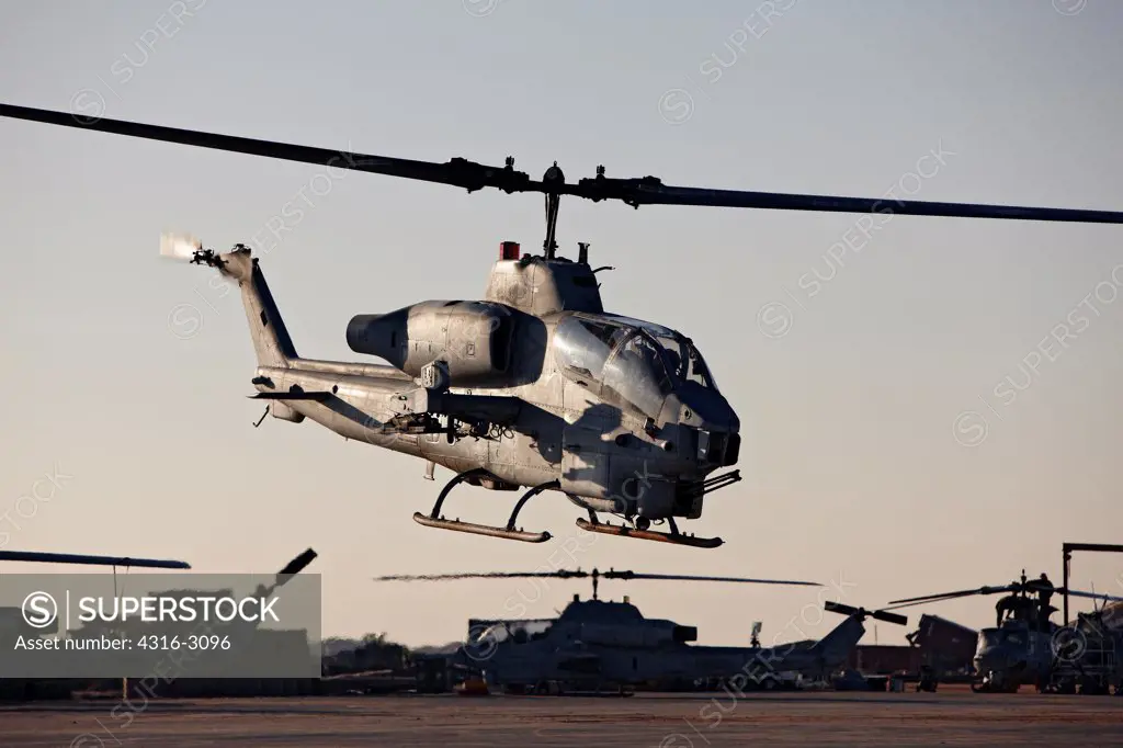 A U.S. Marine Corps AH-1W Super Cobra launches from Camp Bastion, Helmand Province, southern Afghanistan.
