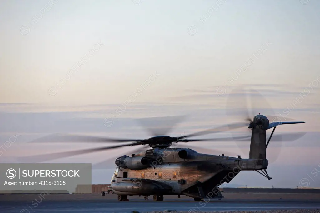 A U.S. Marine Corps CH-53E Super Stallion at dusk, Camp Bastion, Helmand Province, southern Afghanistan.