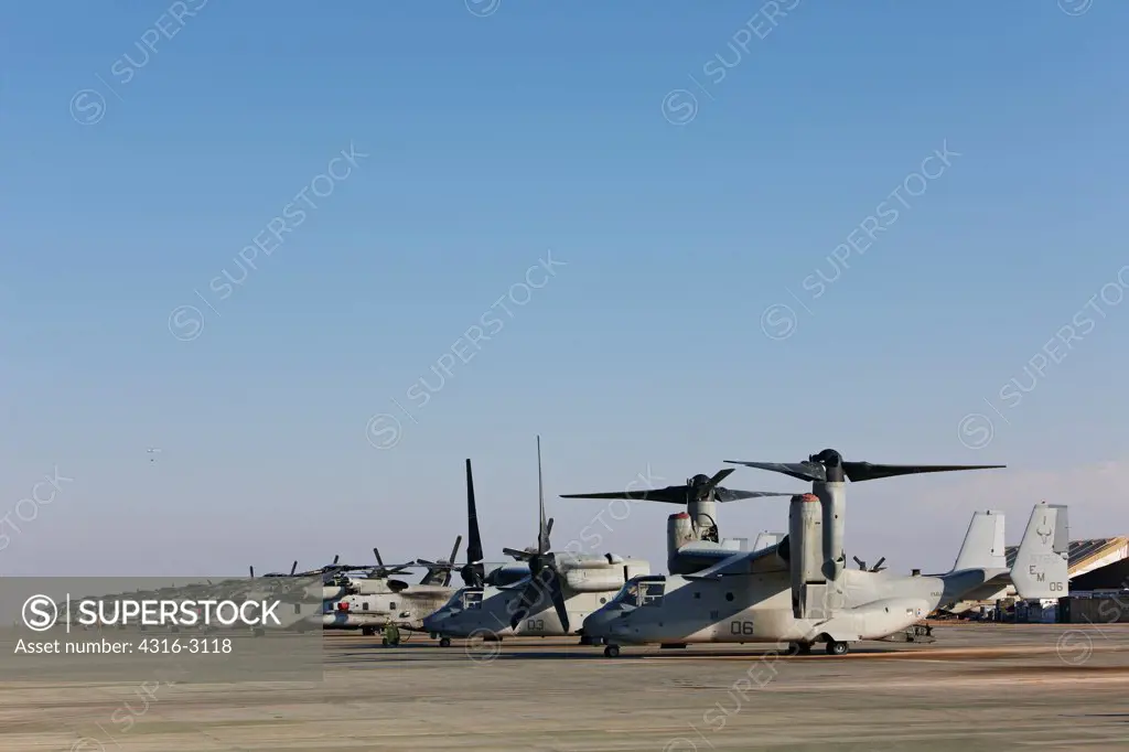 A line of U.S. Marine Corps MV-22 Ospreys and CH-53 helicopters at Camp Bastion, Helmand Province, southern Afghanistan.