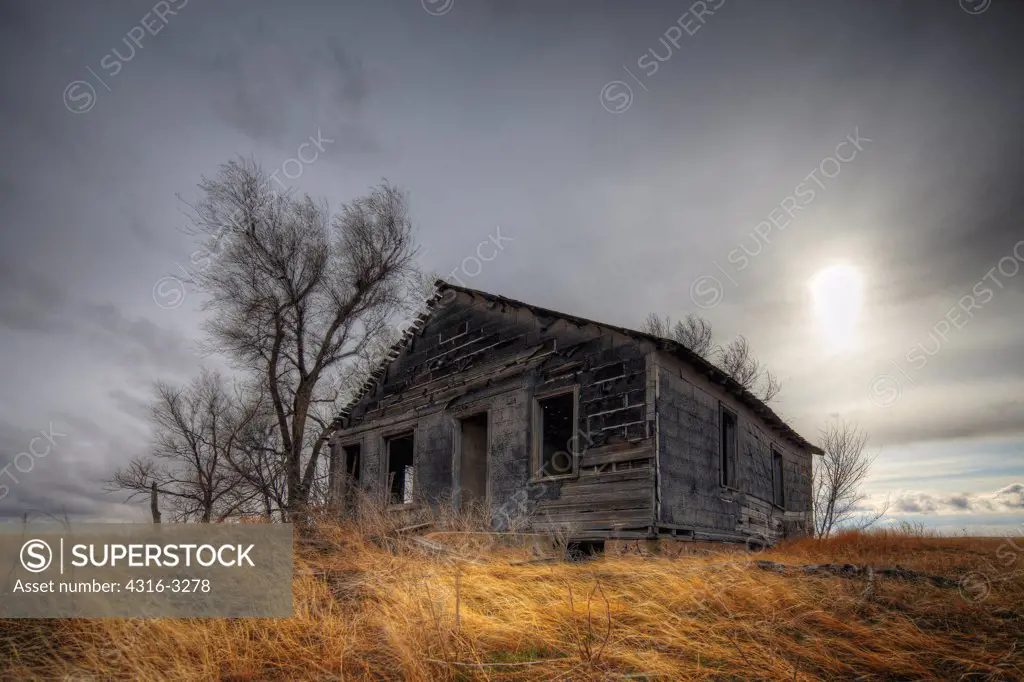 An abandoned farm house, on the eastern plains of Colorado, in a High Dynamic Range (HDR) Image.