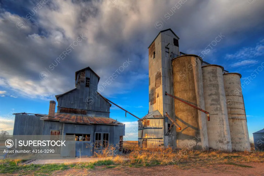 Abandoned grain elevator and grain silos at the ghost town of Willard, in Colorado's eastern plains, in a High Dynamic Range, or HDR view.