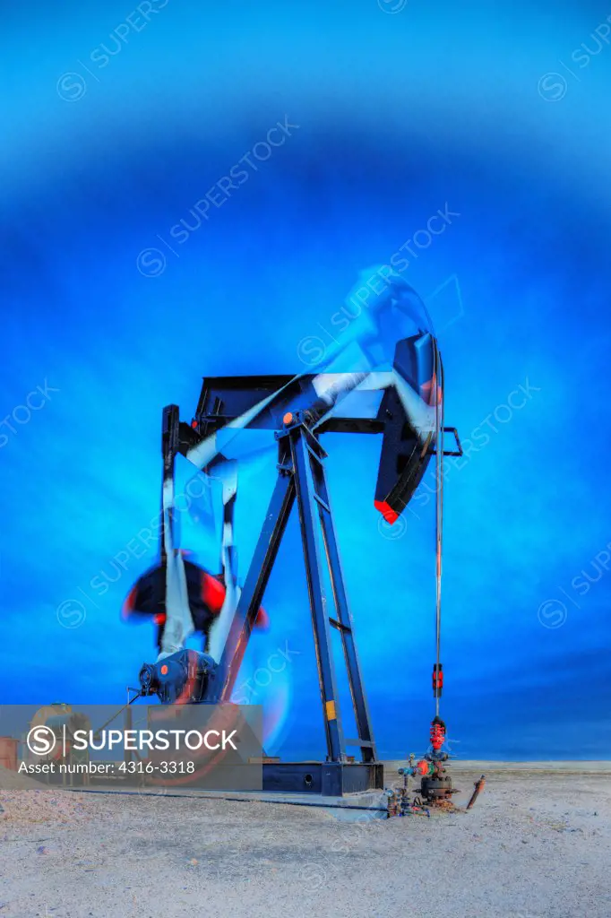 A high dynamic range, or HDR, image of an oil well pump jack in northeastern Colorado, showing motion of the pump, the end known as the 'horsehead' (right side), walking beam, crank, and counterweight. A pump jack is also known as a pumpjack, a pumping unit, a grasshopper pump, and a jack pump, among other names.