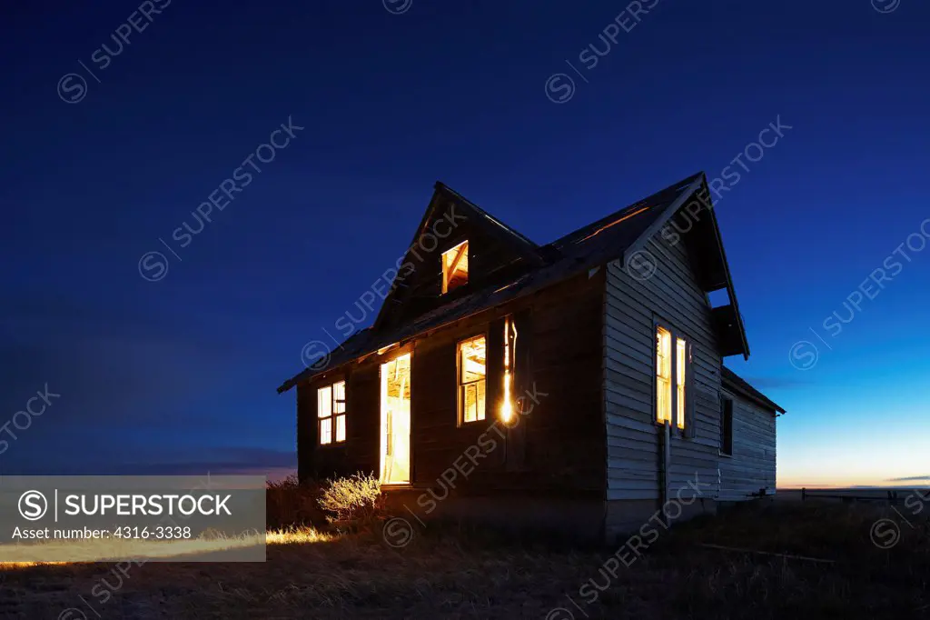 Dusk view of an abandoned farm house in Colorado's eastern plains.