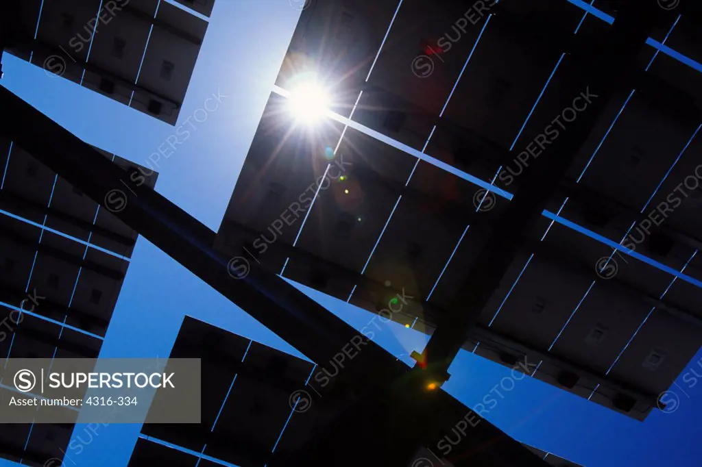 High Noon Sun Bursts Between Solar Panels