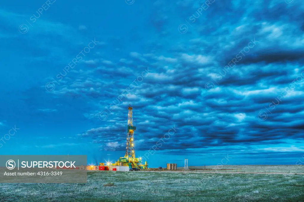 Hydraulic fracturing natural gas drilling rig at dusk, in the eastern Colorado plains. High Dynamic Range, or HDR, view.