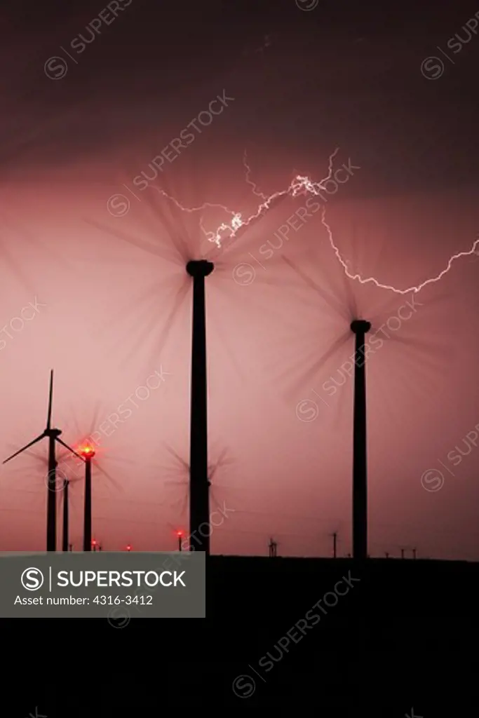 Severe thunderstorm unleashes lightning throughout a wind farm.
