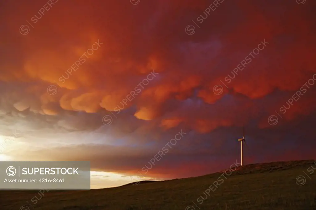 Mammatus clouds over wind farm.