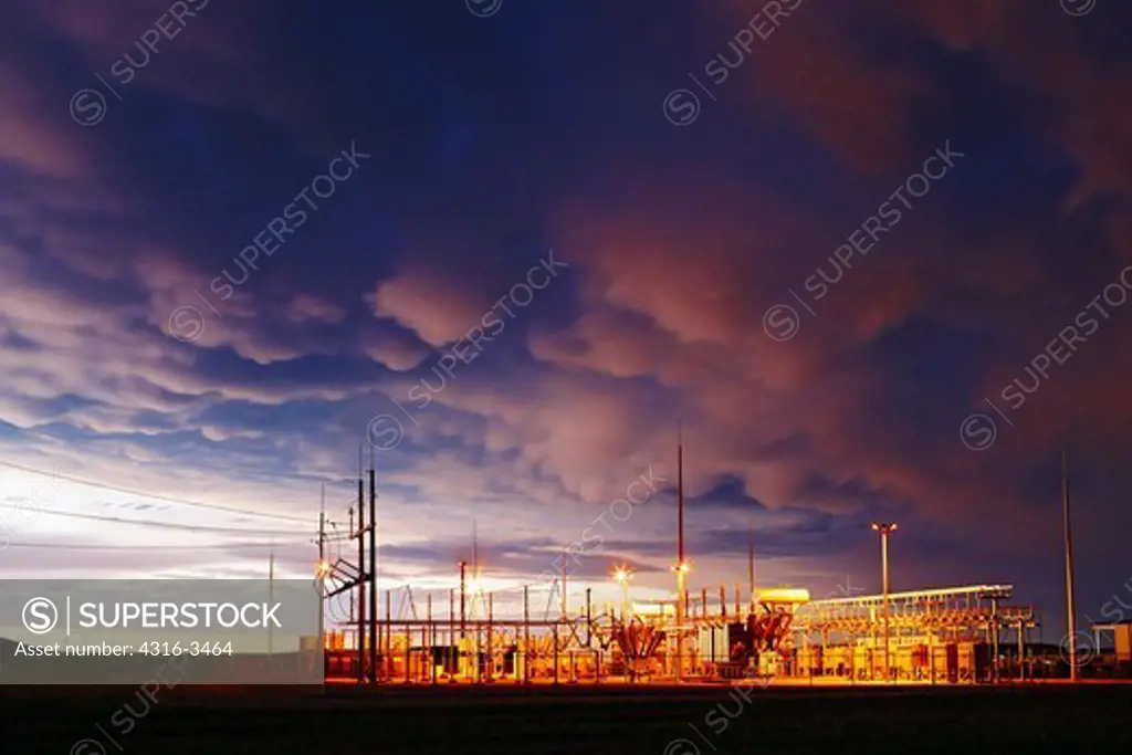 Electrical substation at wind farm, dusk light, mammatus clouds.